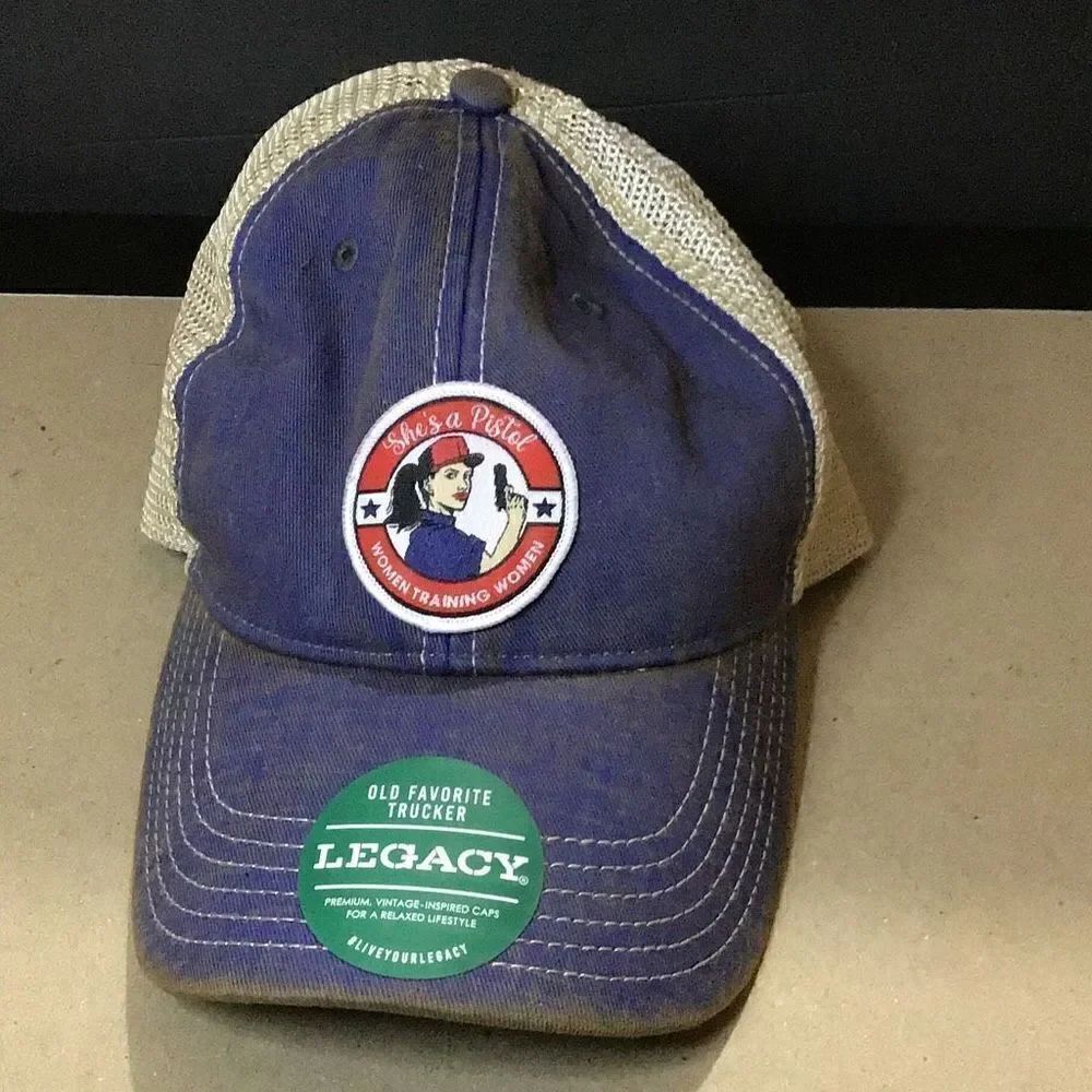 Vintage legacy ladies, trucker hat. She’s a pistol.